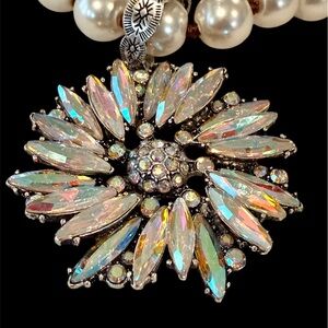 AB crystal pendant on glowing pearl-like strand